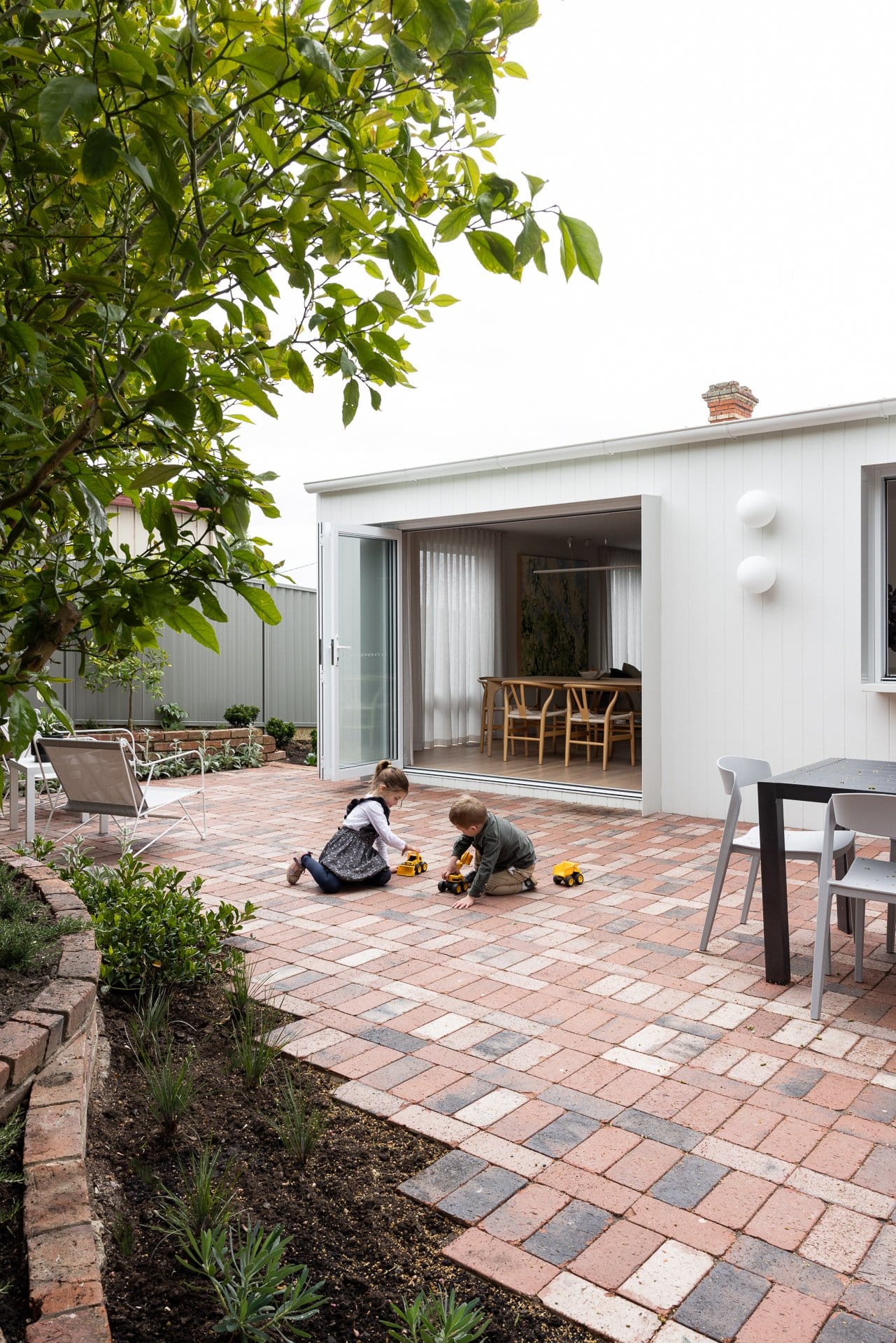 outdoor entertaining area with children playing